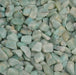 A close-up of tumbled amazonite with a deep green hue.