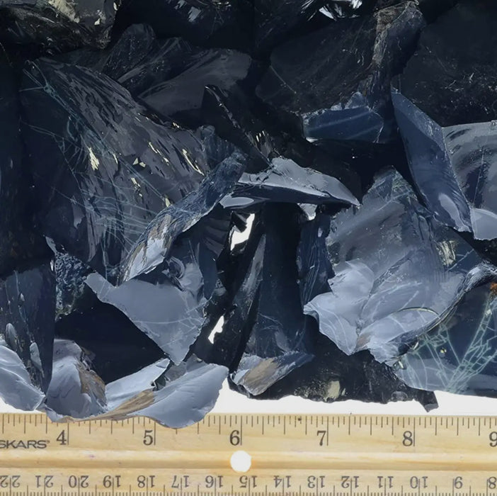 Unpolished rough spider obsidian with a deep, black color and distinctive patterns