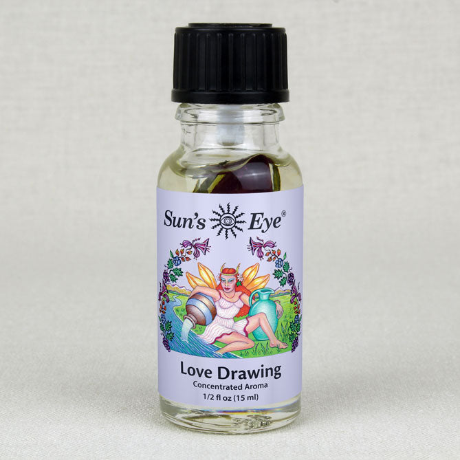 A bottle of Love Drawing Oil with a rose