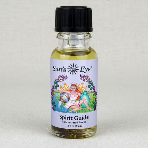 A bottle of Spirit Guide Oil with a feather