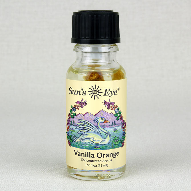 A bottle of Vanilla Orange Oil with a vanilla bean and orange slice